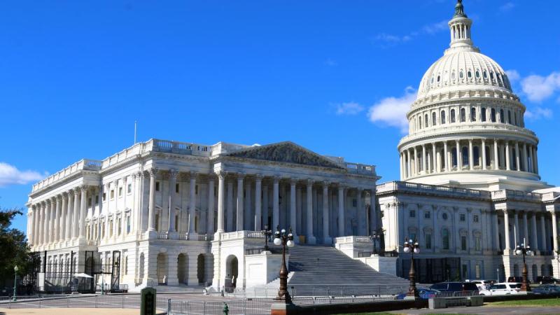 Capitol dome against blue sky